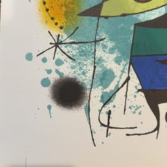 The lower-left corner of the sheet: a clean cream margin with no pencil signature or numbering, beside a black airbrushed spot and a star.